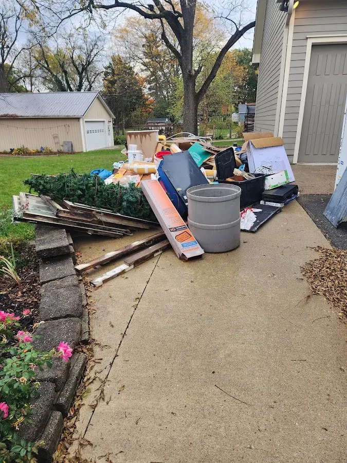 Dumpster being loaded with debris for Commercial Dumpster Rental in Dale City